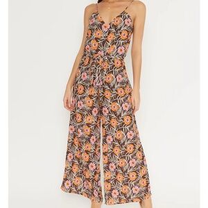 V-neck sleeveless jumpsuit with floral print throughout